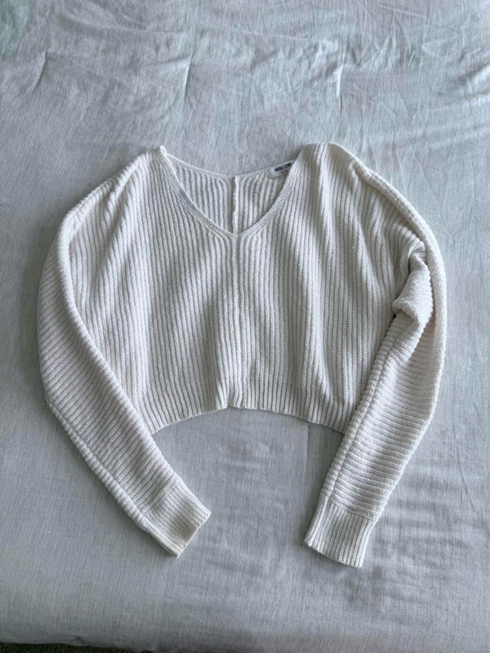 Slouchy off shoulder sweater with flaws
